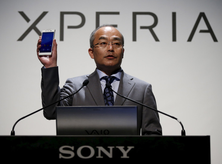 Sony Mobile Communications Inc President and CEO Hiroki Totoki holds up Sony's new Xperia Z4 smartphone during a news conference in Tokyo April 20, 2015. 
