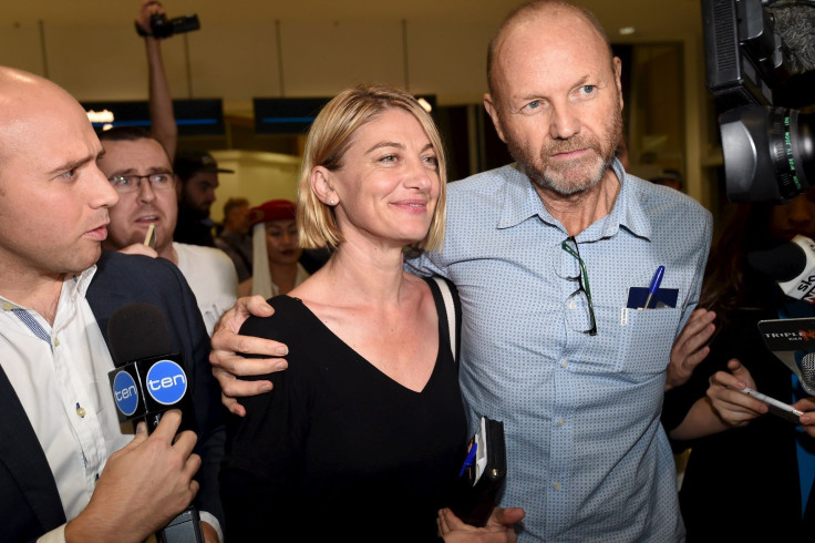 Australian 60 Minutes journalist Tara Brown (C) and 60 Minutes producer Stephen Rice arrive at Sydney International Airport, April 21, 2016.