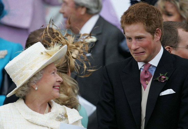 Britain's Queen Elizaberth II smiles as Prince Harry pulls a face as they watch Prince Charles and Camilla, Duchess of Cornwall leave St. George's Chapel. 