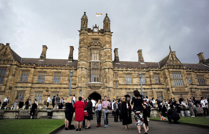 University students walk on the campus of University of Sydney following a graduation ceremony in Sydney, Australia, April 22, 2016.