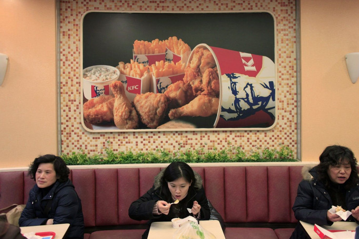 People dine at a Kentucky Fried Chicken (KFC) outlet in Shanghai February 3, 2010.