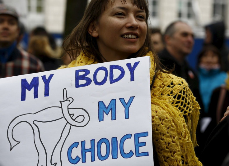 Woman holds a placard as she demonstrates against plans of tightening the abortion law in Warsaw, Poland April 9, 2016.