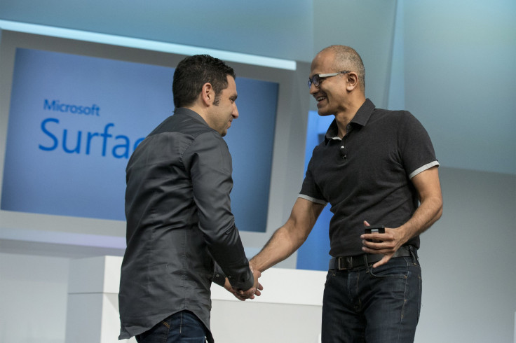 Satya Nadella (R), Microsoft Corp chief executive, greets Panos Panay, corporate vice president for Surface Computing at Microsoft Corp, during the unveil event of the new Microsoft Surface Pro 3 in New York May 20, 2014. 
