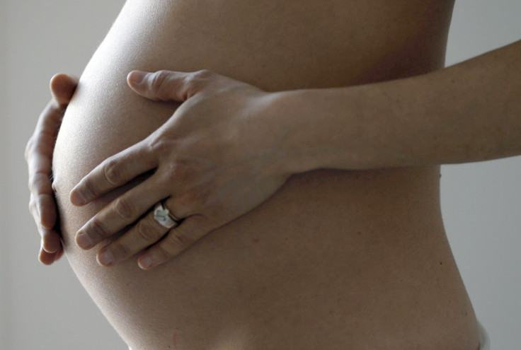 A pregnant woman, in the last trimester of her pregnancy, poses in this illustration photo in Sete, South France, March 26, 2016.