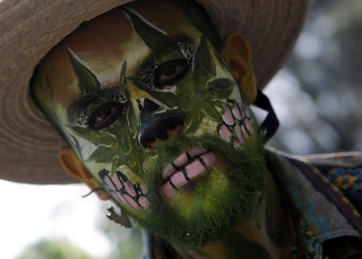 A demonstrator with his face painted takes part during a rally for the legalization of marijuana in Mexico City, Mexico, May 7, 2016.