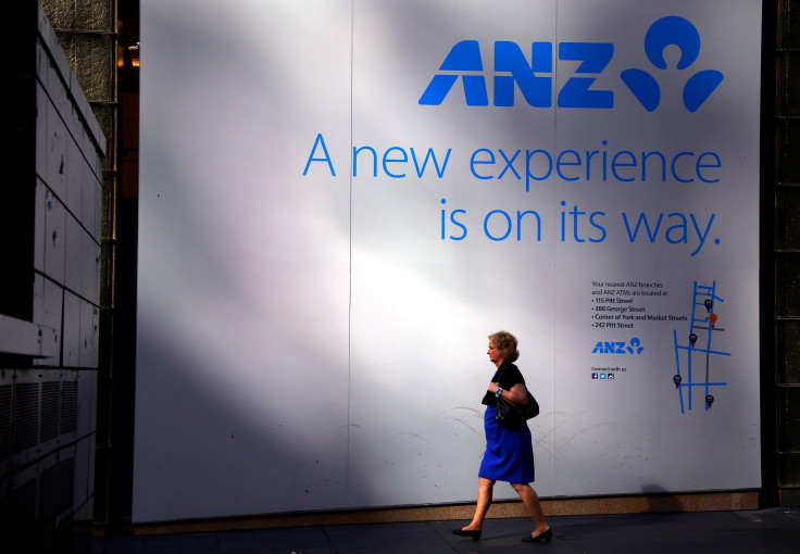A pedestrian walks past a sign stating the opening of a new ANZ Banking Group branch in central Sydney, Australia, April 27, 2016.