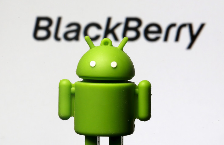 An Android mascot is seen in front of a logo of Blackberry in this photo illustration taken in Zenica, Bosnia and Herzegovina, June 12, 2015. 