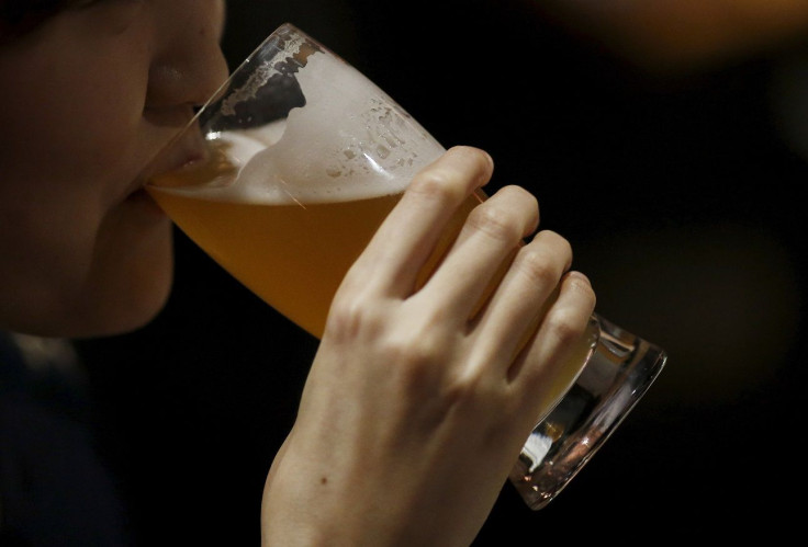 A woman drinks a glass of craft beer at a brewed craft beer pub in Seoul, South Korea, April 8, 2016.