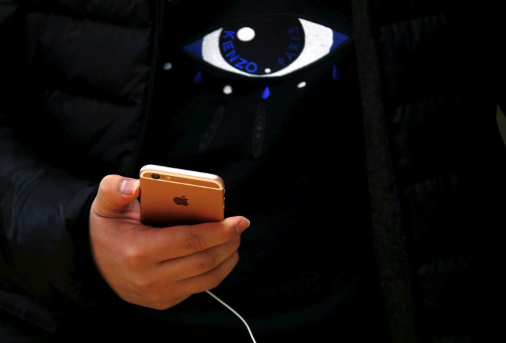 A customer holds an iPhone 6s during the official launch at the Apple store in central Sydney, Australia, September 25, 2015.