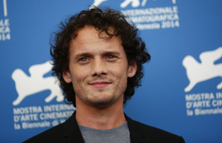 Cast member Anton Yelchin poses during the photo call for the movie "Burying the ex" at the 71st Venice Film Festival September 4, 2014. 