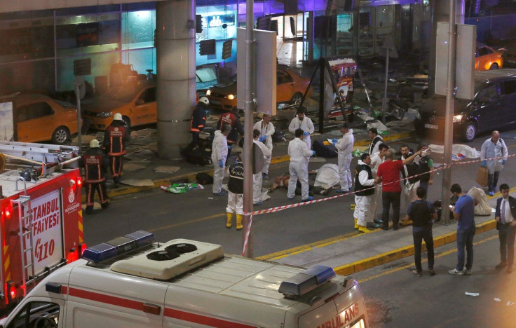 Forensic experts work outside Turkey's largest airport, Istanbul Ataturk, Turkey, following a blast, June 28, 2016.