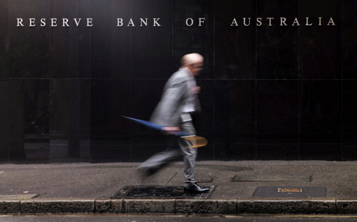 A businessman walks past the headquarters of Australia's Reserve Bank in Sydney, November 3, 2015.