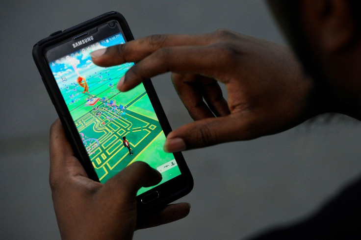 A virtual map of Bryant Park is displayed on the screen as a man plays the augmented reality mobile game "Pokemon Go" by Nintendo in New York City, U.S. July 11, 2016.