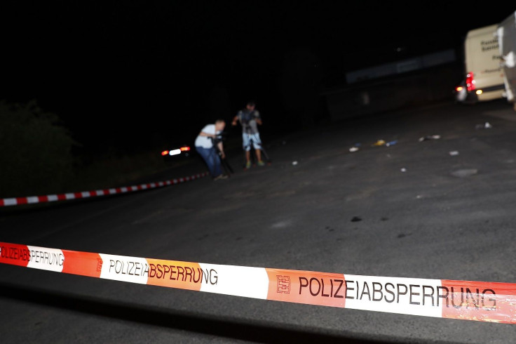 Cameramen film at the scene where a man was shot dead by the police after attacking passengers on a train with an axe near the city of Wuerzburg, Germany July 19, 2016.