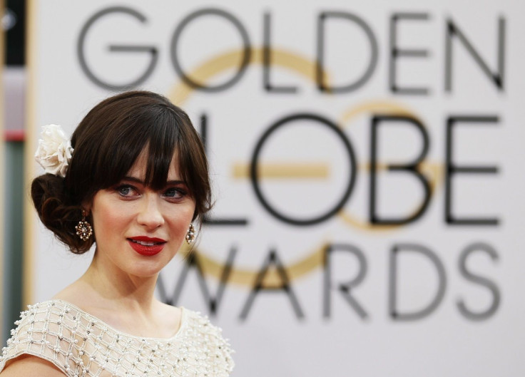 Actress Zooey Deschanel arrives at the 71st annual Golden Globe Awards in Beverly Hills, California January 12, 2014.