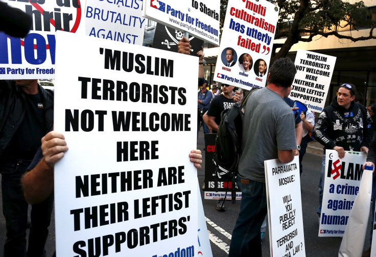Demonstrators demanding the closure of the Parramatta Mosque hold placards during a rally outside the mosque in western Sydney, Australia, October 9, 2015.