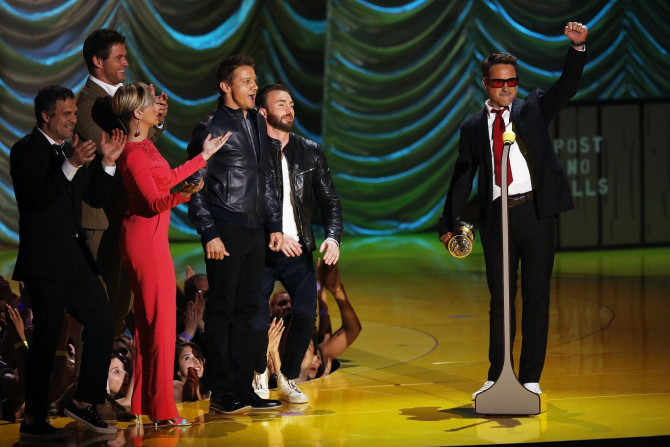 Actor Robert Downey Jr. accepts the MTV Generation Award from his fellow Avengers cast members during the 2015 MTV Movie Awards in Los Angeles, California April 12, 2015.