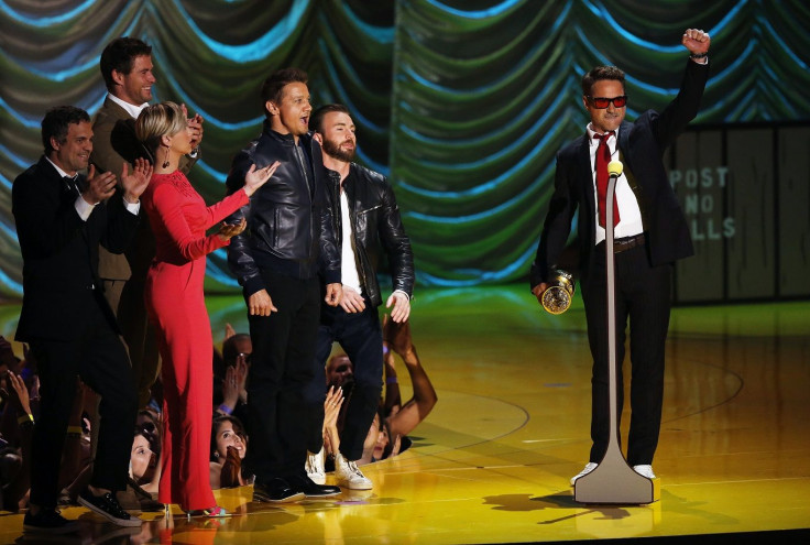 Actor Robert Downey Jr. accepts the MTV Generation Award from his fellow Avengers cast members during the 2015 MTV Movie Awards in Los Angeles, California April 12, 2015.