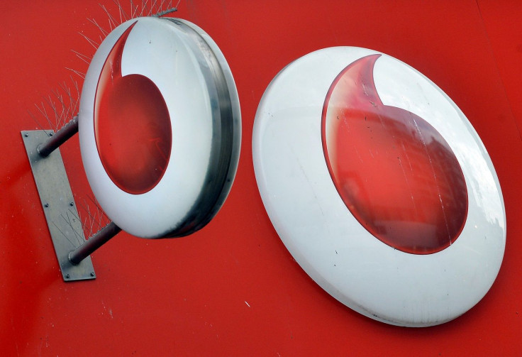 Vodafone branding is seen outside a retail store in London November 12, 2013.
