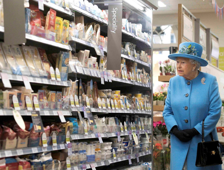Britain's Queen Elizabeth looks at products on the shelves at a Waitrose supermarket during a visit  to the town of Poundbury, Britain October 27, 2016.