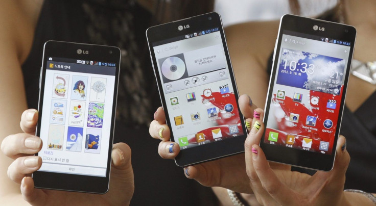 Models pose with new "Optimus G" smartphones, made by LG Electronics Inc, in Seoul September 18, 2012.