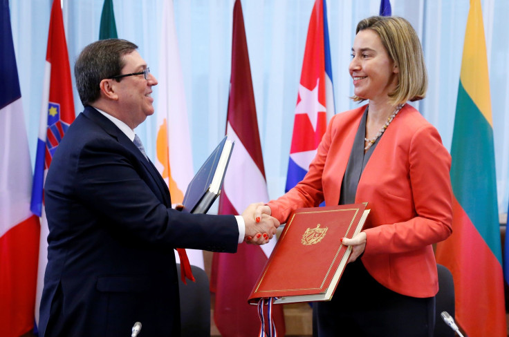 Cuba's Foreign Minister Bruno Rodriguez shakes hands with European Union foreign policy chief Federica Mogherini