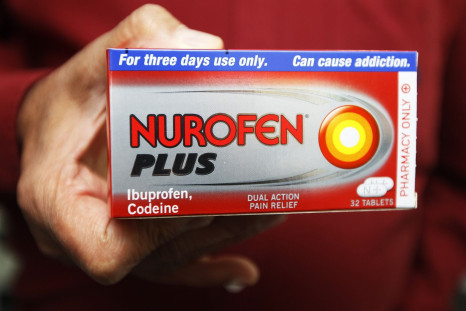 A chemist holds a box of Nurofen Plus at a pharmacy in London August 27, 2011.