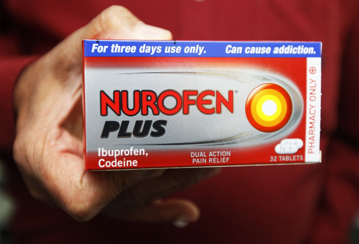A chemist holds a box of Nurofen Plus at a pharmacy in London August 27, 2011.