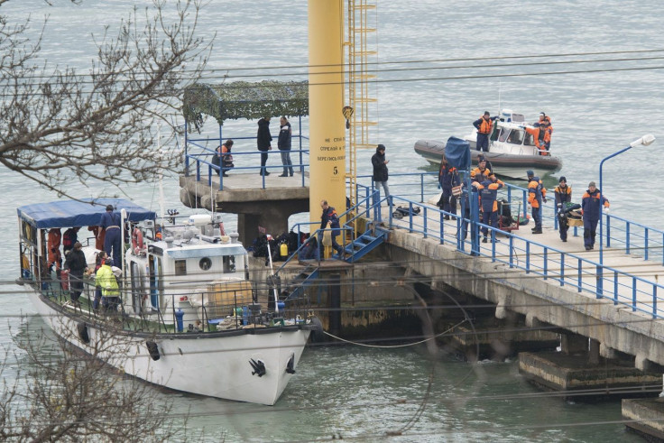 Russian Emergencies Ministry members work at a quay of the Black Sea near the crash site of Russian military Tu-154 plane, in the Sochi suburb of Khosta, Russia, Russia December 25, 2016