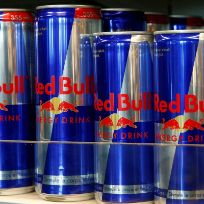 Cans of Red Bull energy drink are offered at a supermarket.