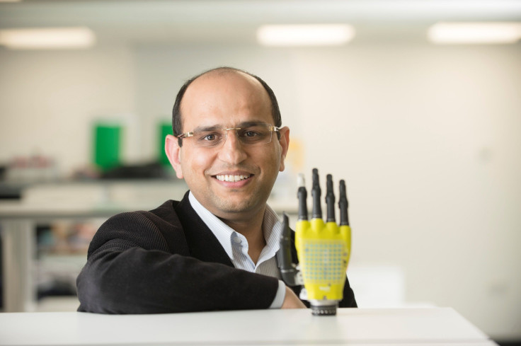 Ravinder Dahiya of the University of Glasgow’s School of Engineering poses with the prosthetic hand developed by his team at Glasgow University, Scotland, Britain