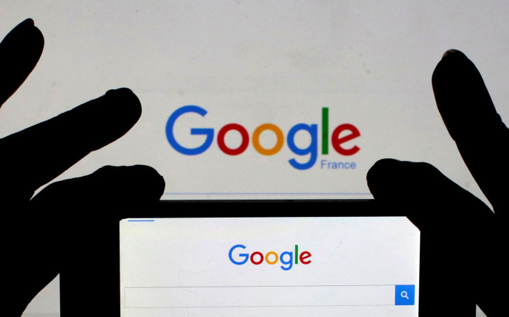 A woman holds her smart phone, which displays the Google home page, in this picture illustration