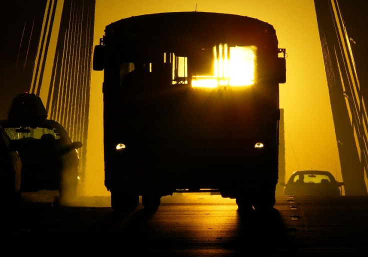 A commuter bus drives across Anzac bridge during peak afternoon traffic in Sydney August 23, 2004.