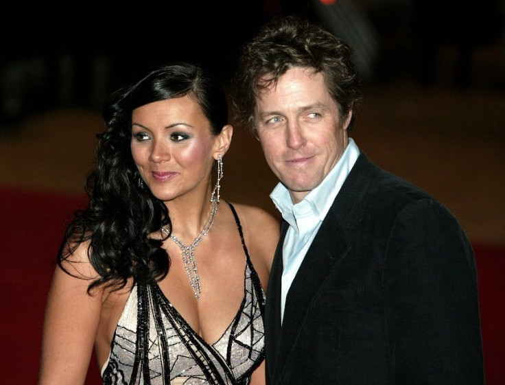 British actors Hugh Grant (R) and Martine McCutcheon arrive for the UK charity premiere of the film, in which they star, 'Love Actually' at the Odeon Leicester Square, London, November 16, 2003. 
