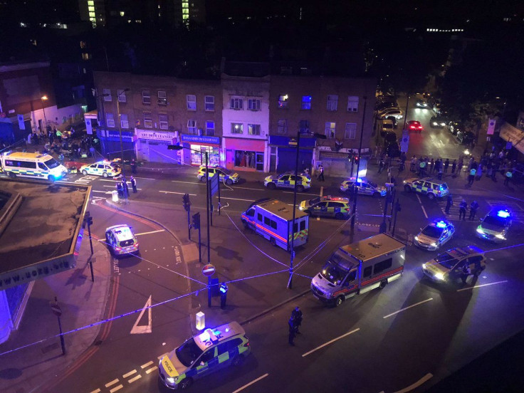 Police officers attend to the scene after a vehicle collided with pedestrians in the Finsbury Park neighborhood of North London, Britain June 19, 2017.