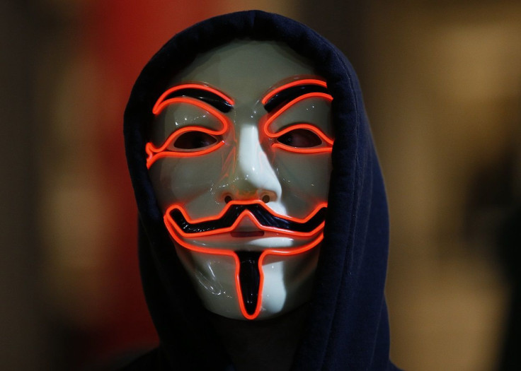 A supporter of the activist group Anonymous wears a mask during a protest in London, Britain November 5, 2015.