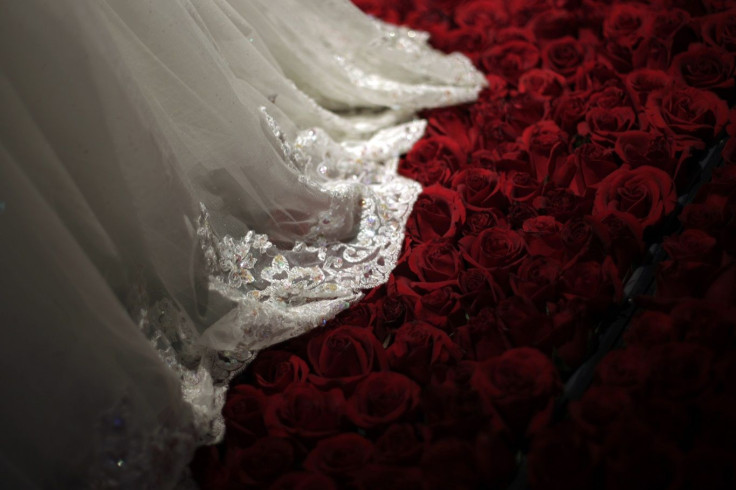 A wedding dress is displayed during a group wedding ceremony hosted by the French Pavilion at the Shanghai World Expo May 11, 2010.