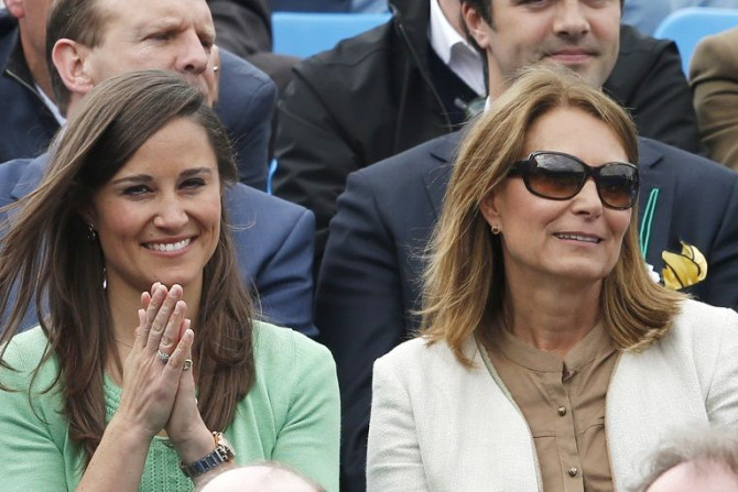 Pippa (L) and Carol Middleton watch Dan Evans of Britain play Juan Martin del Potro of Argentina at the Queen's Club Championships in west London June 13, 2013.