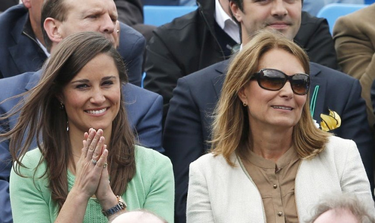 Pippa (L) and Carol Middleton watch Dan Evans of Britain play Juan Martin del Potro of Argentina at the Queen's Club Championships in west London June 13, 2013.