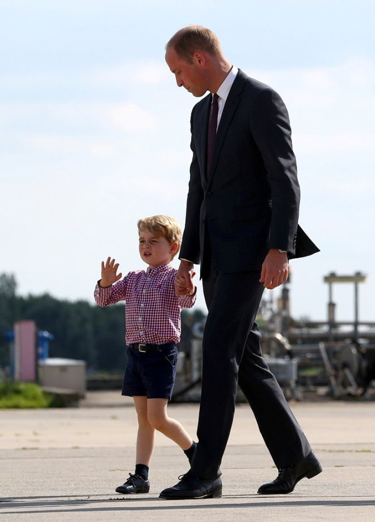Britain's Prince William, the Duke of Cambridge walks with Prince George at the airfield in Hamburg Finkenwerder, Germany, July 21, 2017.