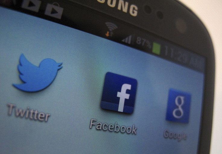 A Facebook icon is shown on a Samsung Galaxy III mobile phone in this photo illustration in Encinitas, California, January 30, 2013.