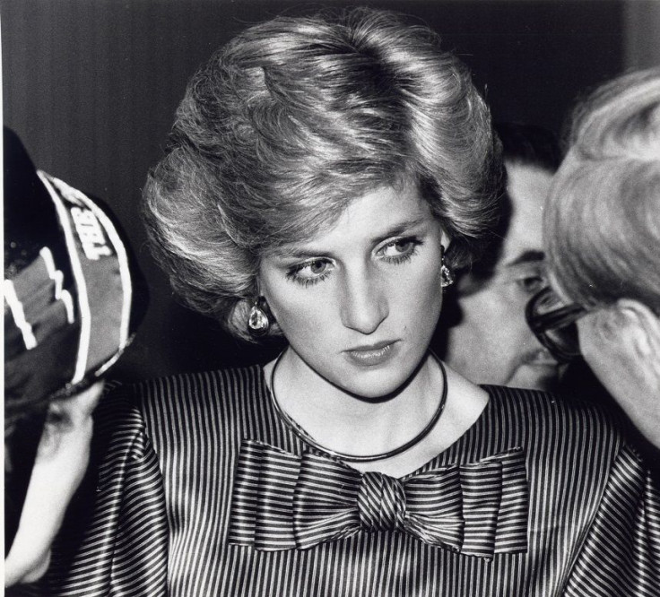 Princess Diana wearing a striped dress with matching bow attends a Salvation Army Carol Service in Central London December 4, 1985.