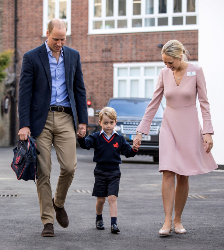 Helen Haslem, head of the lower school and Britain's Prince William hold Prince George's hands as he arrives for his first day of school at Thomas's school in Battersea, London, September 7, 2017.