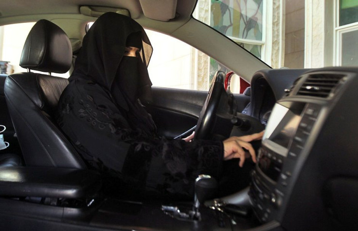 FILE PHOTO: A woman drives a car in Saudi Arabia October 22, 2013.