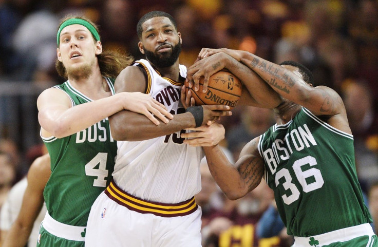 Cleveland Cavaliers center Tristan Thompson (13) fights for possession with Boston Celtics center Kelly Olynyk (41) and guard Marcus Smart (36)