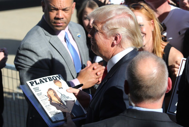 U.S. Republican presidential candidate Donald Trump holds a copy of Playboy Magazine