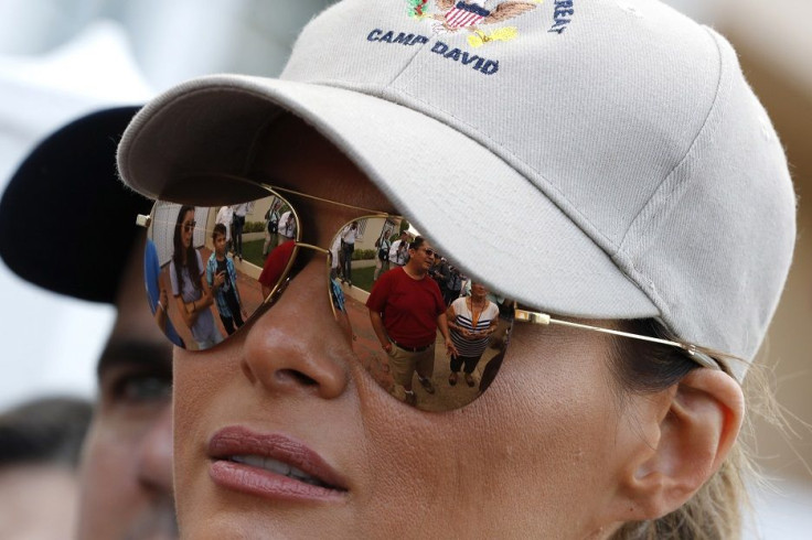 U.S. first lady Melania Trump walks through a neighborhood damaged by Hurricane Maria in San Juan, Puerto Rico, U.S., October 3, 2017.