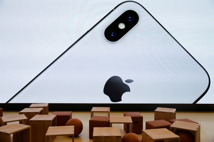 An iPhone X is seen on a large video screen in the new Apple Visitor Center in Cupertino, California, U.S., November 17, 2017.