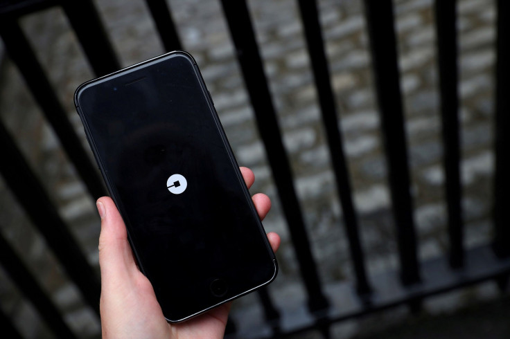 The Uber logo is seen on mobile telephone in London, Britain, September 25, 2017.