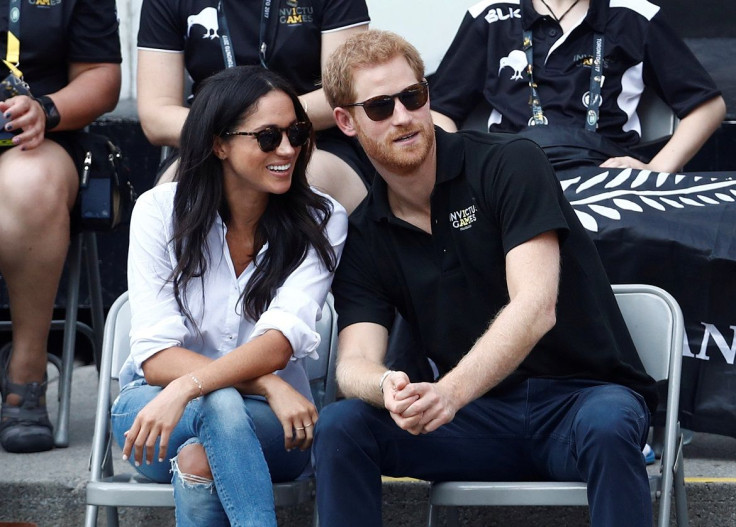 Britain's Prince Harry (R) sits with girlfriend actress Meghan Markle to watch a wheelchair tennis event during the Invictus Games in Toronto, Ontario, Canada September 25, 2017.